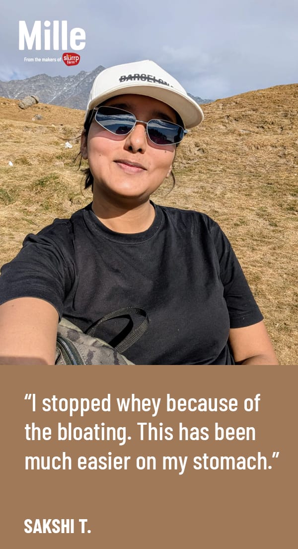 Person wearing sunglasses and a cap with text overlay on a mountainous background